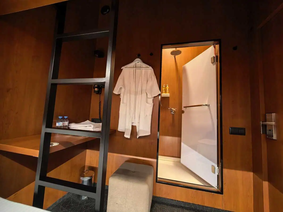 GettSleep coupe lower bed orange LED lighting access ladder dark wood ceiling Terminal C