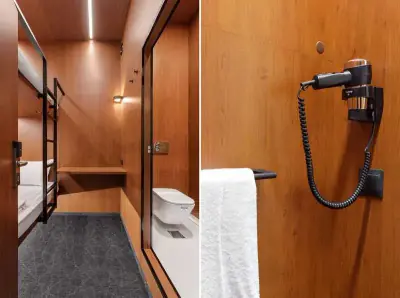 Primer plano cama inferior cupé GettSleep tira LED naranja panel madera Terminal C