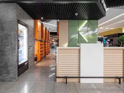 Señalización iluminada entrada recepción GettSleep Terminal B salidas